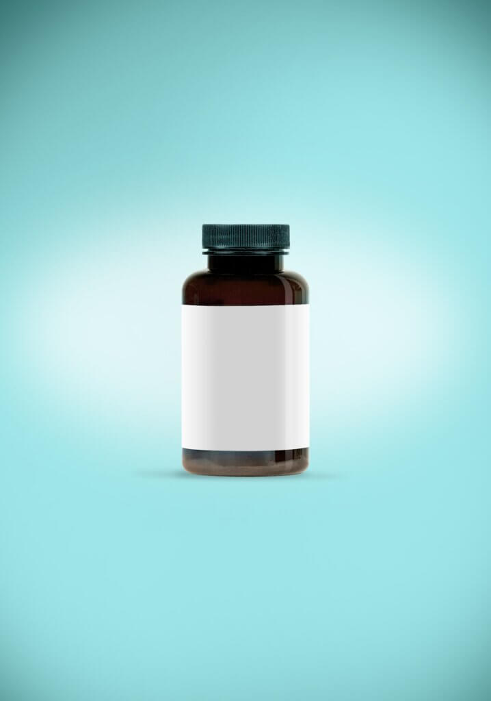 Pill bottle against blue background