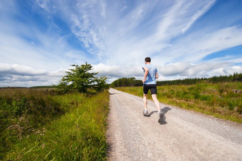 Person running on a trail outside