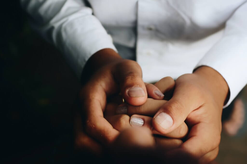 two people holding hands