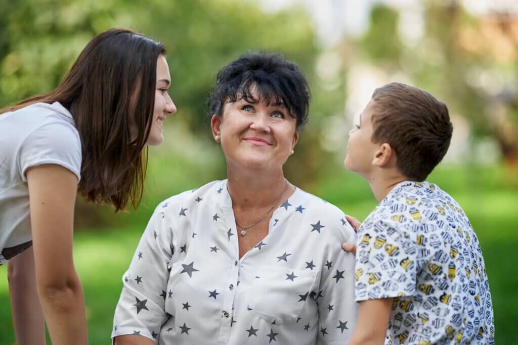 mom and two kids at the park