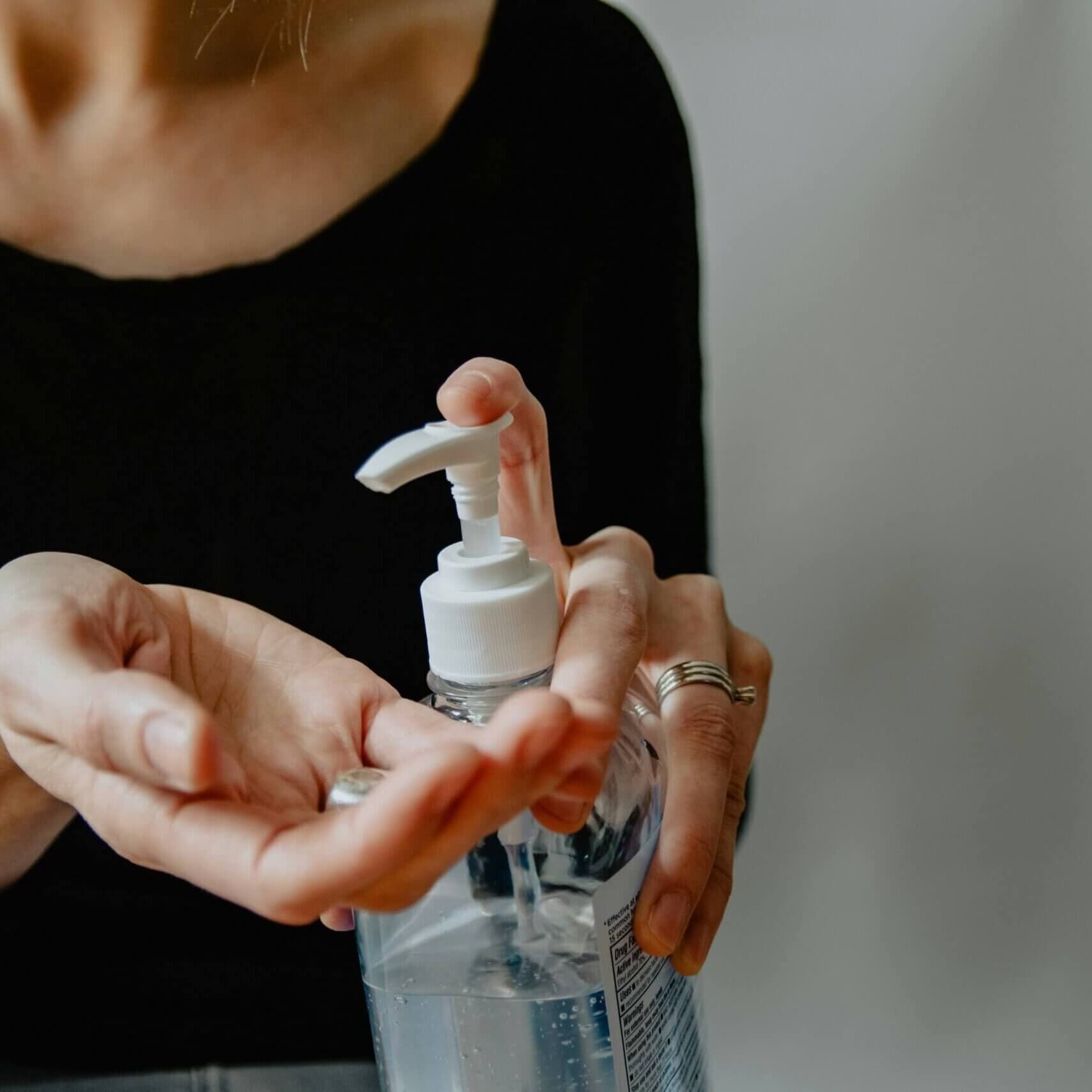 Someone using hand sanitizer